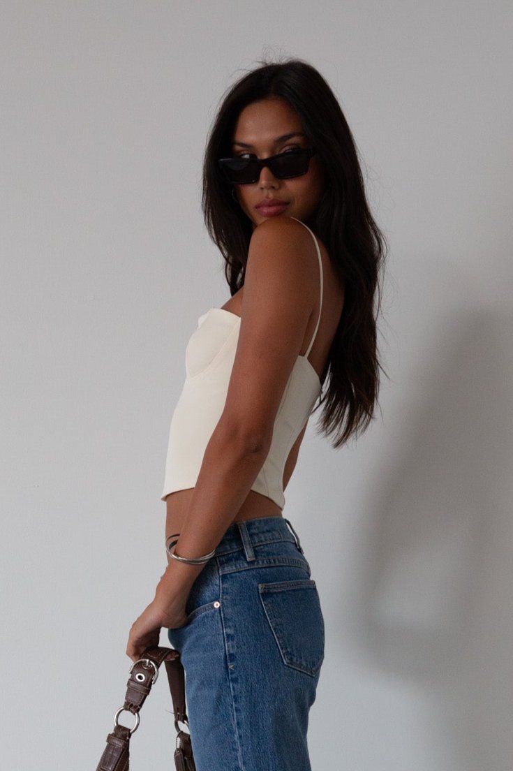 Woven crop top. Fixed straps. Back hook and eye and zipper closures. Fully lined. cream tank top. cream crop top tank. summer top. going out top