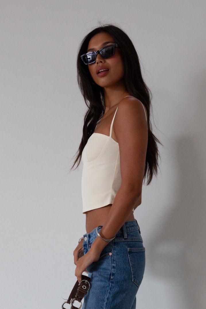 Woven crop top. Fixed straps. Back hook and eye and zipper closures. Fully lined. cream tank top. cream crop top tank. summer top. going out top