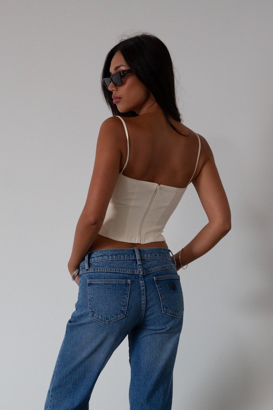 Woven crop top. Fixed straps. Back hook and eye and zipper closures. Fully lined. cream tank top. cream crop top tank. summer top. going out top