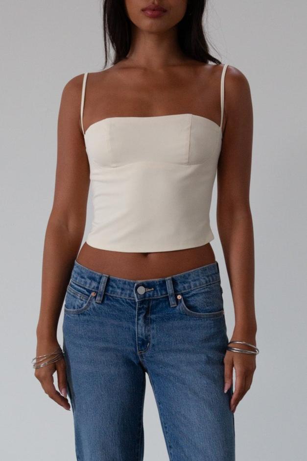 Woven crop top. Fixed straps. Back hook and eye and zipper closures. Fully lined. cream tank top. cream crop top tank. summer top. going out top
