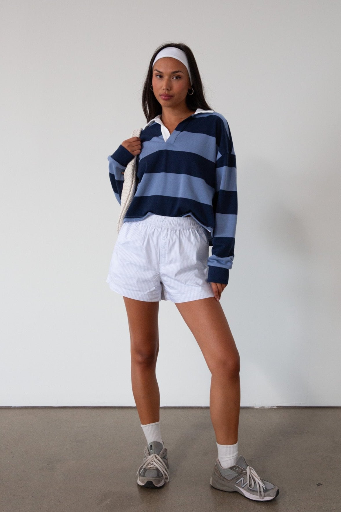 Striped knit crop top. Collar neckline. Long sleeves. Oversized fit. Unlined. polo long sleeve. lounge top. dress down top