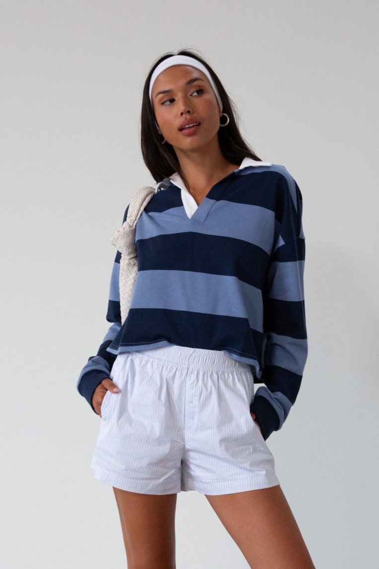 Striped knit crop top. Collar neckline. Long sleeves. Oversized fit. Unlined. polo long sleeve. lounge top. dress down top