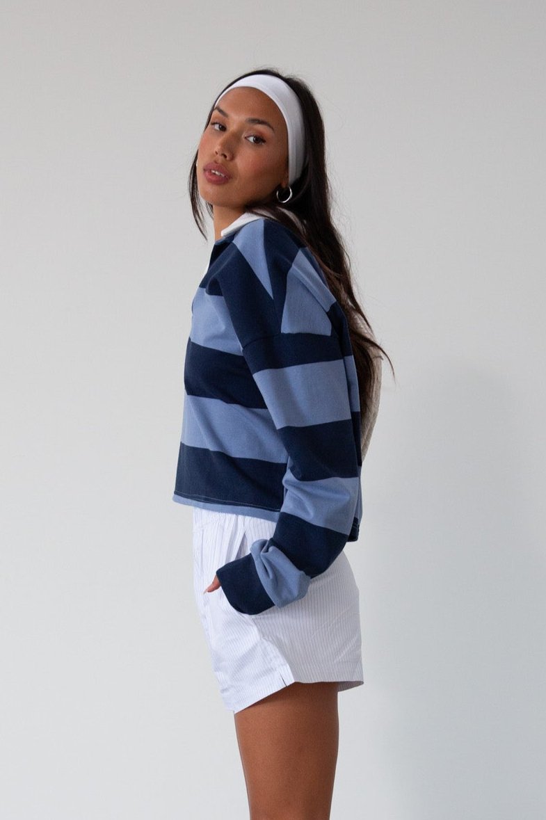 Striped knit crop top. Collar neckline. Long sleeves. Oversized fit. Unlined. polo long sleeve. lounge top. dress down top