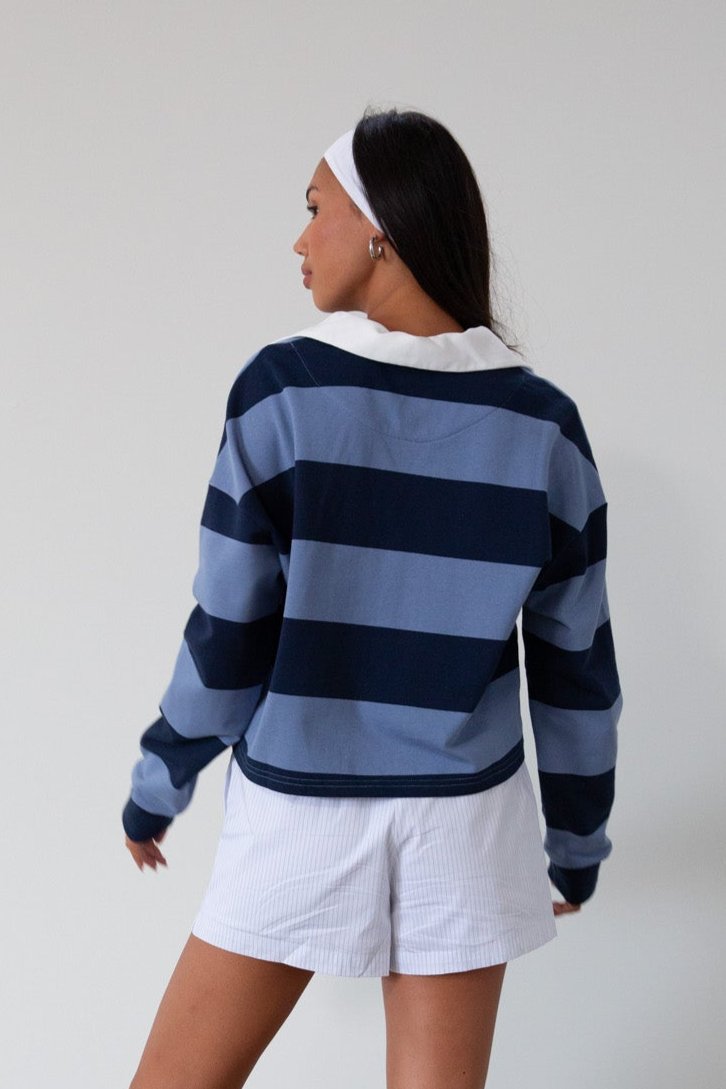 Striped knit crop top. Collar neckline. Long sleeves. Oversized fit. Unlined. polo long sleeve. lounge top. dress down top