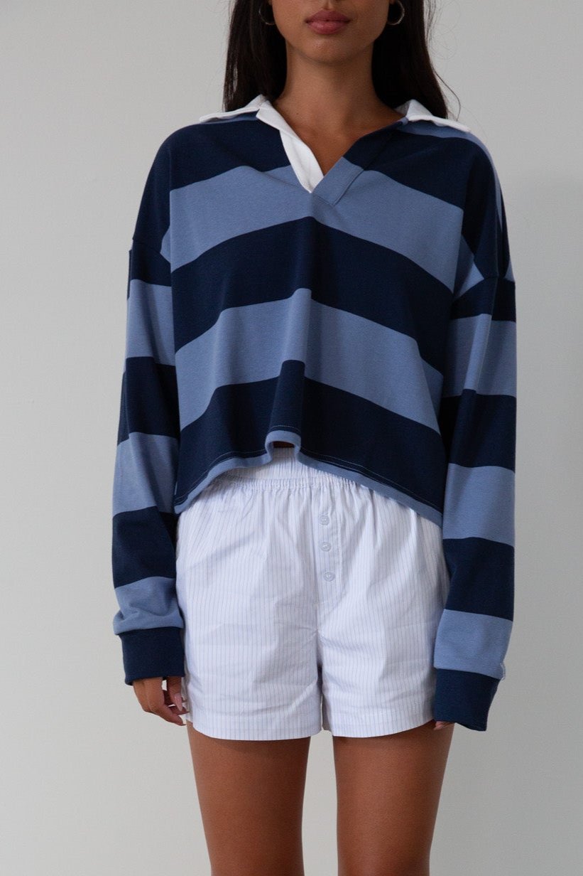 Striped knit crop top. Collar neckline. Long sleeves. Oversized fit. Unlined. polo long sleeve. lounge top. dress down top