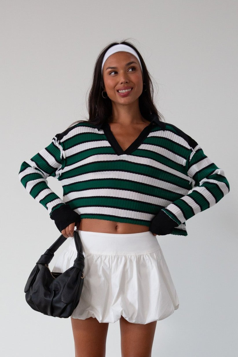 Striped ribbed knit crop top. Collar neckline. Long sleeves. Raw hem. Unlined. green and white stripe sweater long sleeve top