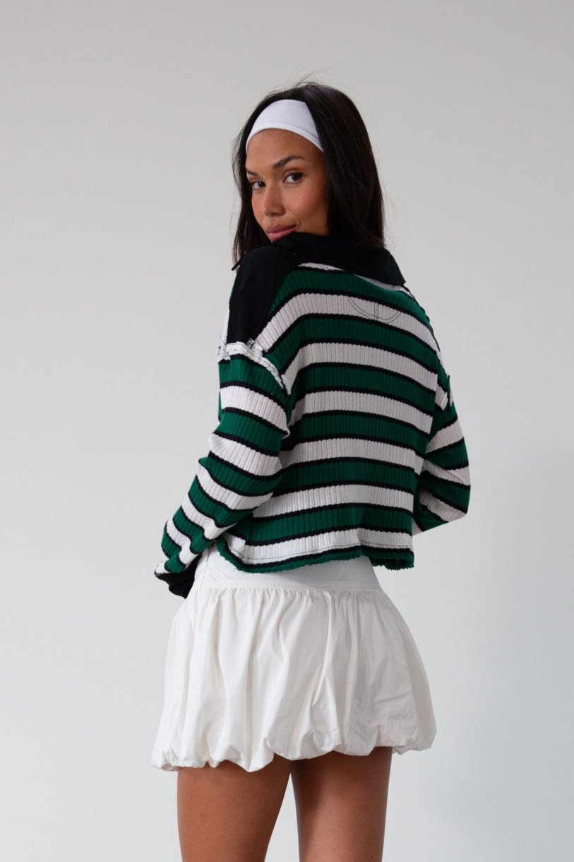 Striped ribbed knit crop top. Collar neckline. Long sleeves. Raw hem. Unlined. green and white stripe sweater long sleeve top