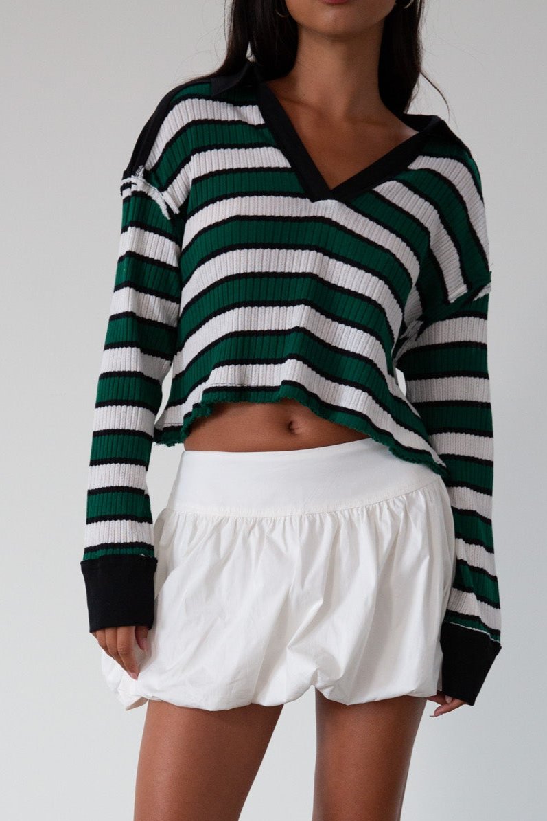 Striped ribbed knit crop top. Collar neckline. Long sleeves. Raw hem. Unlined. green and white stripe sweater long sleeve top