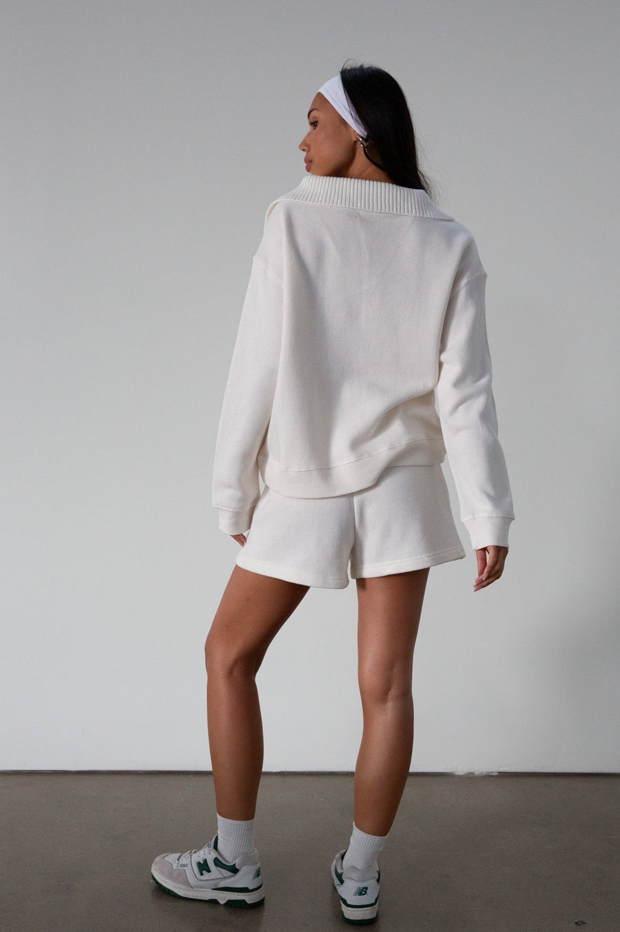 Knit shorts. Elastic waist and drawstring closure. Front pockets. Fleece lining. lounge shorts. sweat shorts. ivory sweat shorts. cream sweat shorts. loungewear