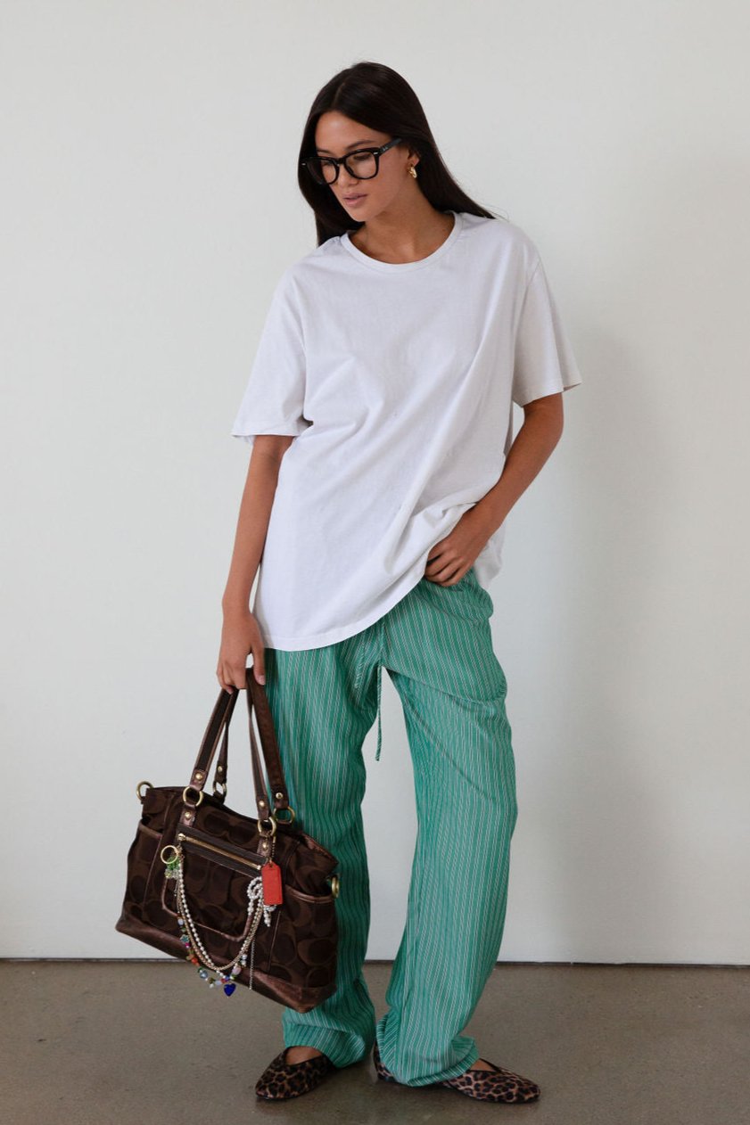 green Striped woven pants. Elastic waistband with drawstring closure. Side pockets. Unlined. fall transition outfit. lounge outfit. cute casual outfit