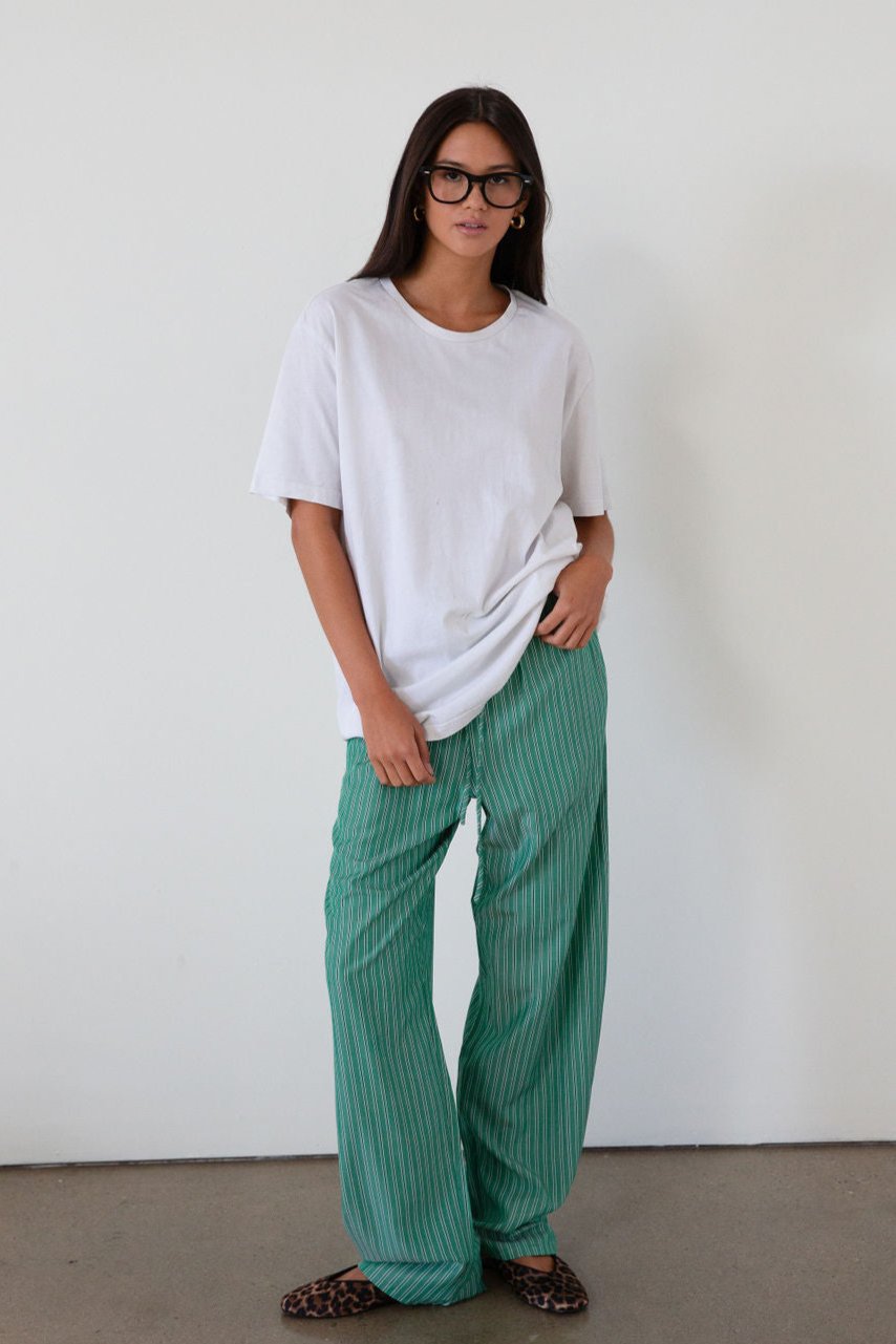 green Striped woven pants. Elastic waistband with drawstring closure. Side pockets. Unlined. fall transition outfit. lounge outfit. cute casual outfit