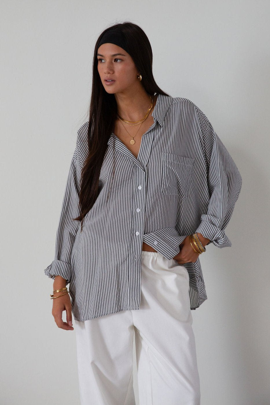 Striped woven shirt. Collar neckline. Long sleeves with button closure. Front button down closures. Front pocket. Unlined.&nbsp;