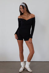 Knit romper. Long sleeves. Surplice neckline. Unlined. black romper. black off the shoulder romper. on the go cute outfit.
