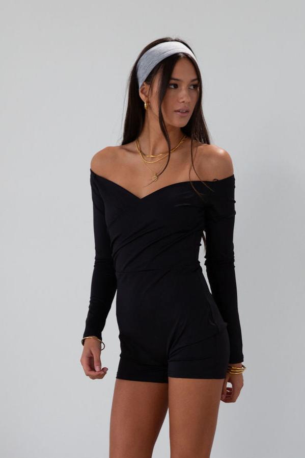 Knit romper. Long sleeves. Surplice neckline. Unlined. black romper. black off the shoulder romper. on the go cute outfit.