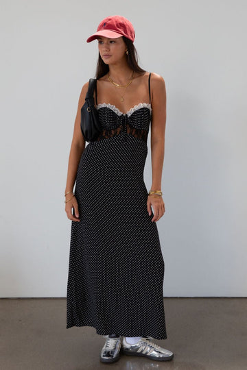 Polka dot printed woven midi dress. Lace details. Adjustable straps. Underwire cups. Back hook and eyes and zipper closures. Unlined.