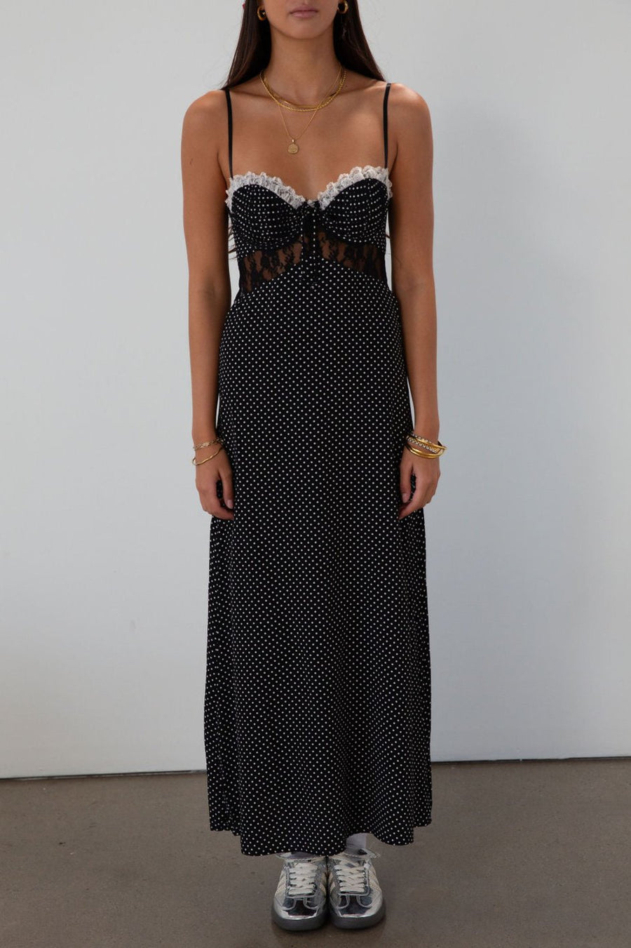 Polka dot printed woven midi dress. Lace details. Adjustable straps. Underwire cups. Back hook and eyes and zipper closures. Unlined.