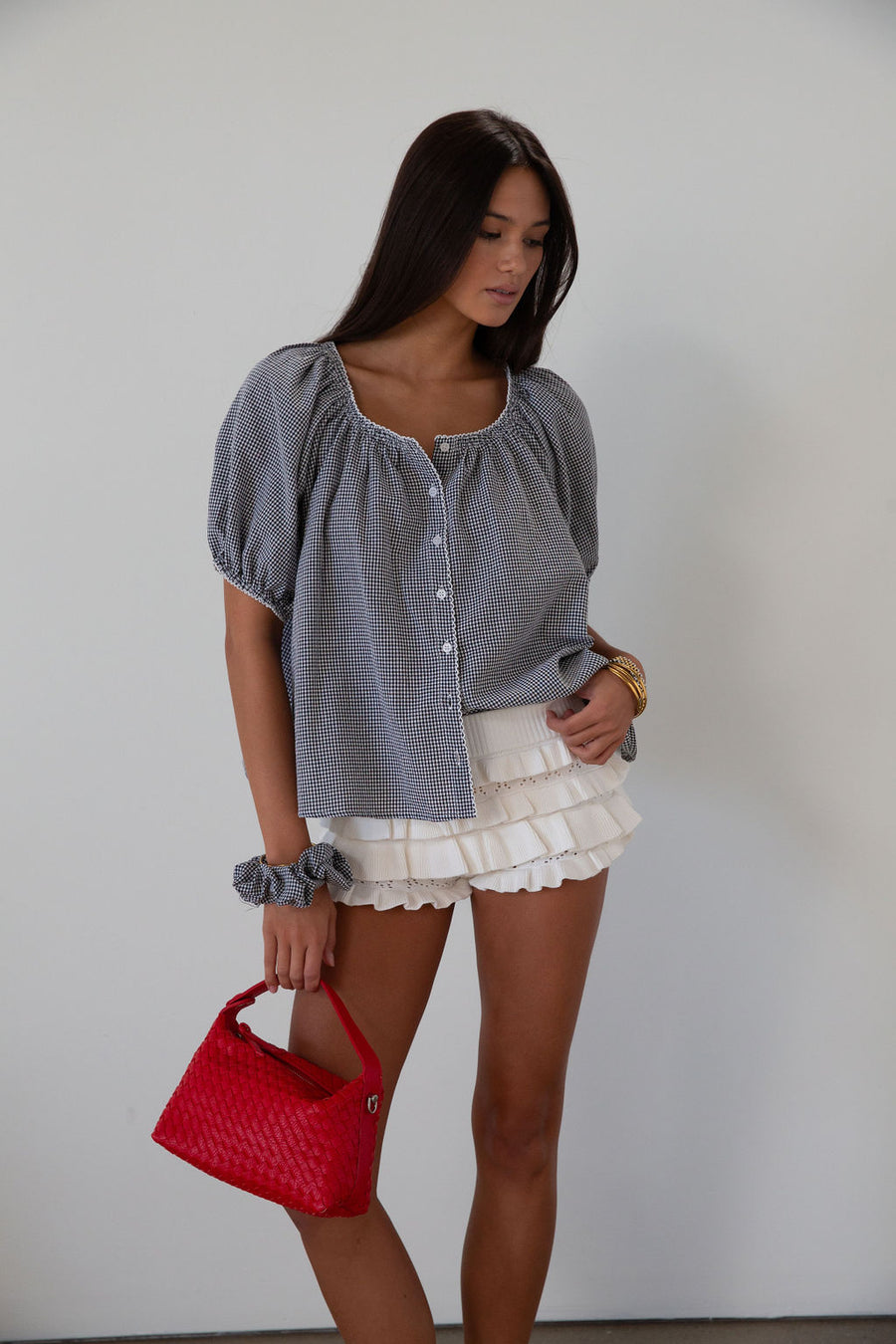white Knit ruffle eyelet mini shorts.