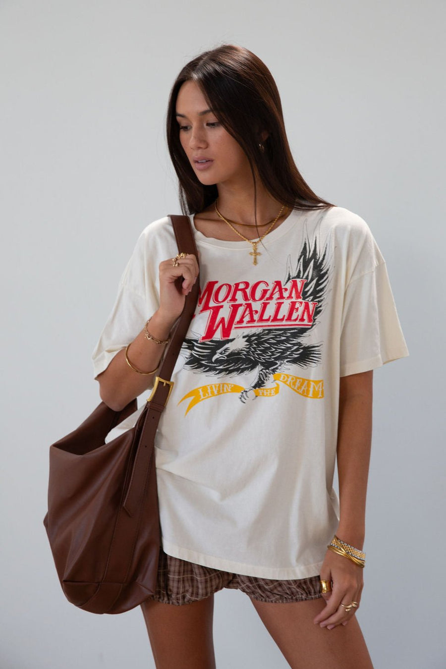 Shoulder bag. Adjustable belt strap. Inner zipper pocket. brown leather bag