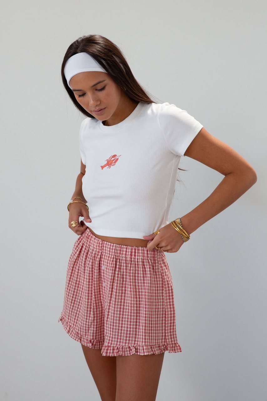 Graphic printed knit crop tee. Crewneck. Short sleeves. Unlined. lobster tee. baby lobster tee. white baby tee