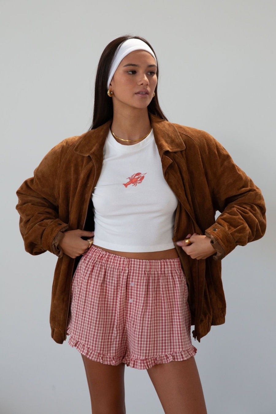 Graphic printed knit crop tee. Crewneck. Short sleeves. Unlined. lobster tee. baby lobster tee. white baby tee