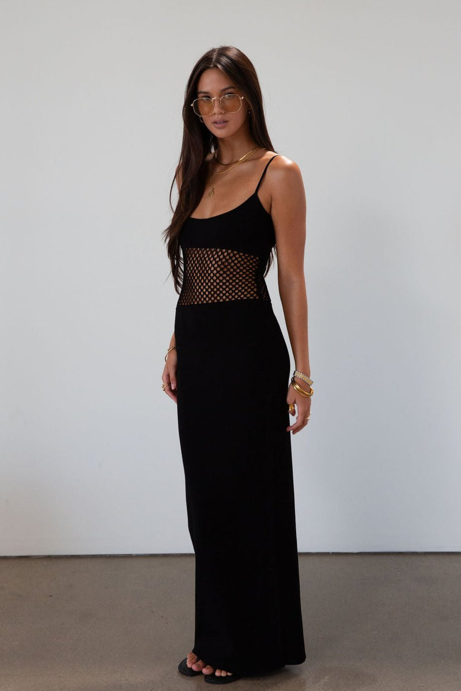 Ribbed knit maxi dress. Adjustable straps. Net mesh waist panel. Unlined. resort wear. resort dress. vacation dress. fancy dinner dress. black maxi dress