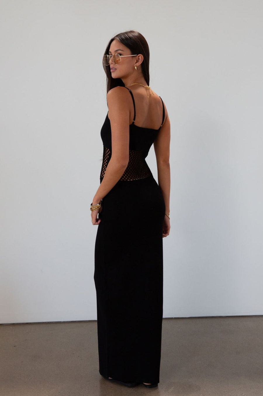 Ribbed knit maxi dress. Adjustable straps. Net mesh waist panel. Unlined. resort wear. resort dress. vacation dress. fancy dinner dress. black maxi dress