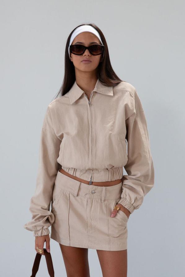 Denim skirt. Button and zipper fly. Four pocket construction. Unlined. tan denim skirt. fall outfit