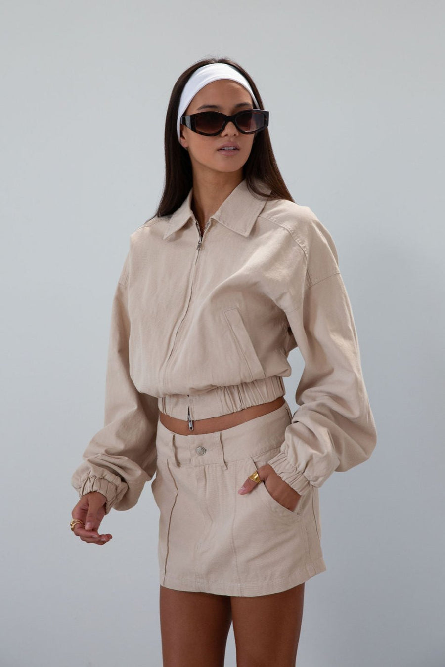 Denim skirt. Button and zipper fly. Four pocket construction. Unlined. tan denim skirt. fall outfit