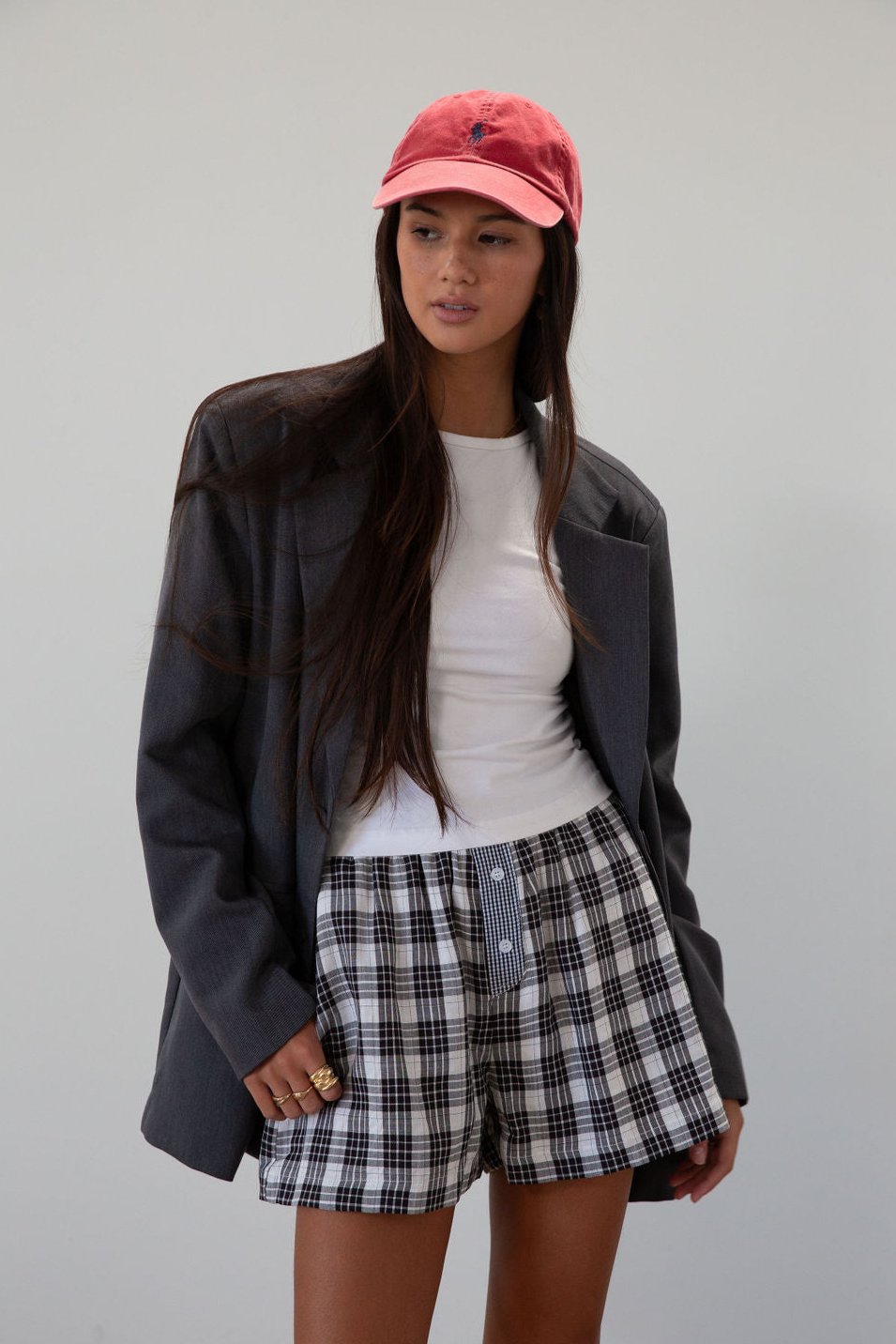 Plaid woven shorts. Elastic waistband. Faux button fly. Side pockets. Fully lined. plaid boxer shorts. black and white boxer shorts. fall outfit