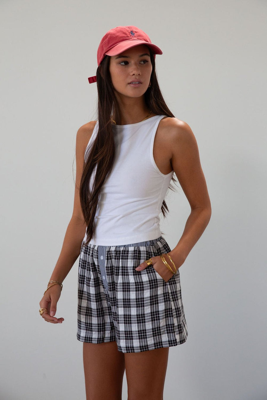 Plaid woven shorts. Elastic waistband. Faux button fly. Side pockets. Fully lined. plaid boxer shorts. black and white boxer shorts. fall outfit