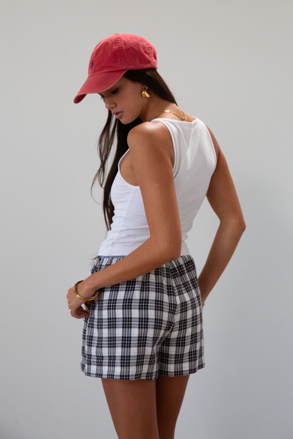 Plaid woven shorts. Elastic waistband. Faux button fly. Side pockets. Fully lined. plaid boxer shorts. black and white boxer shorts. fall outfit