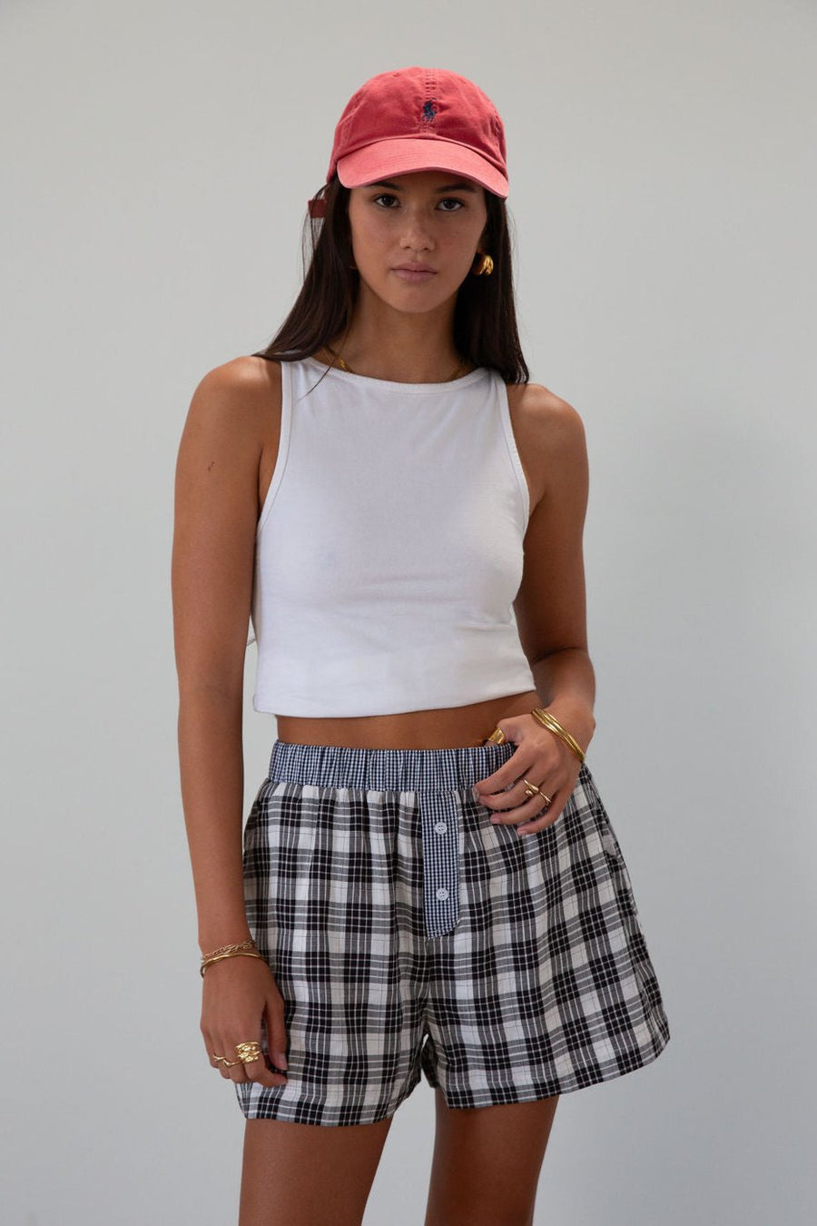 Plaid woven shorts. Elastic waistband. Faux button fly. Side pockets. Fully lined. plaid boxer shorts. black and white boxer shorts. fall outfit