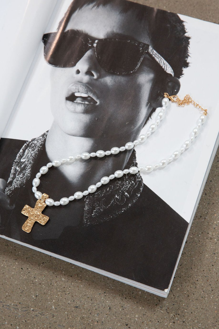 Beaded layered cross necklace. Adjustable lobster clasp closure.