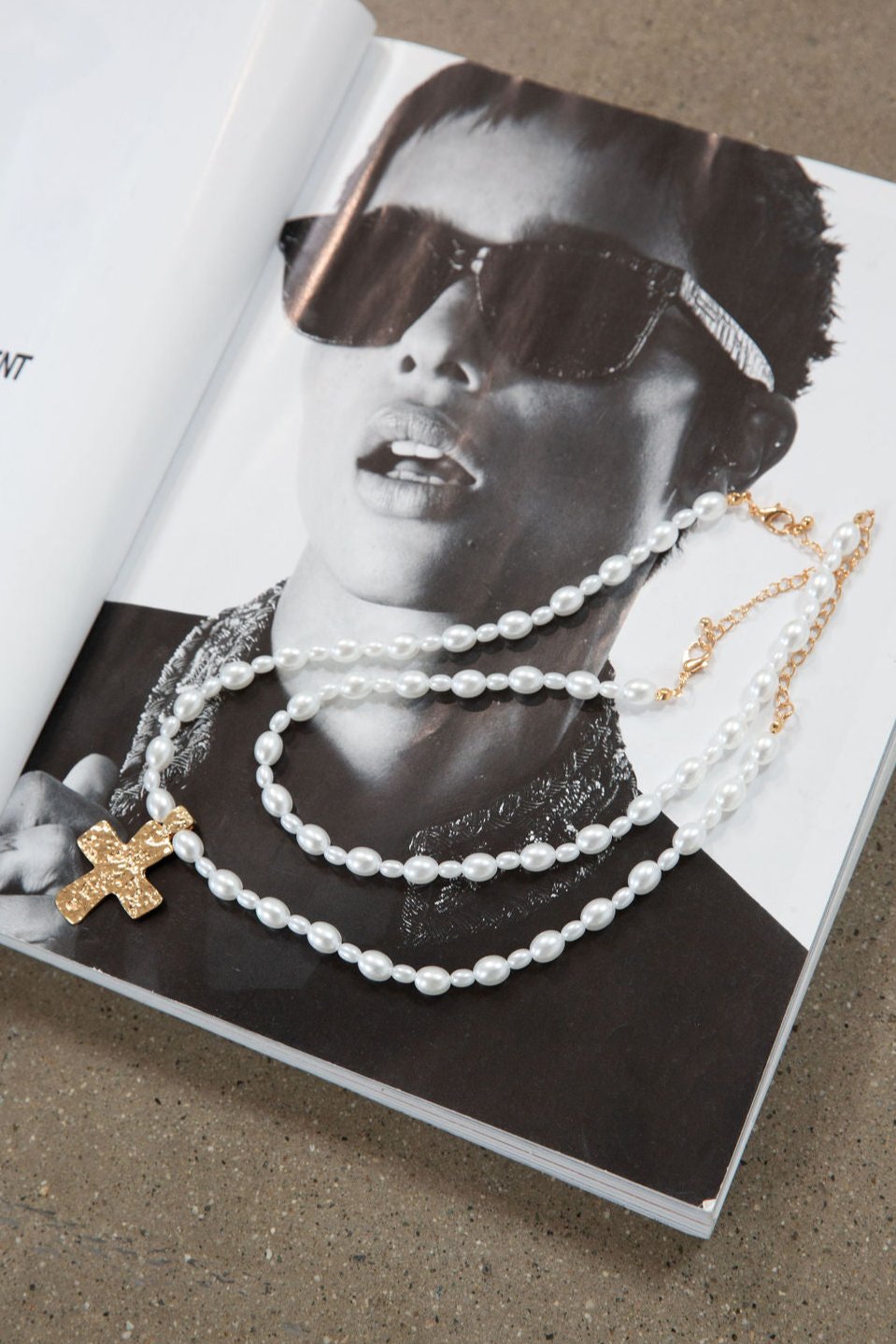 Beaded layered cross necklace. Adjustable lobster clasp closure.