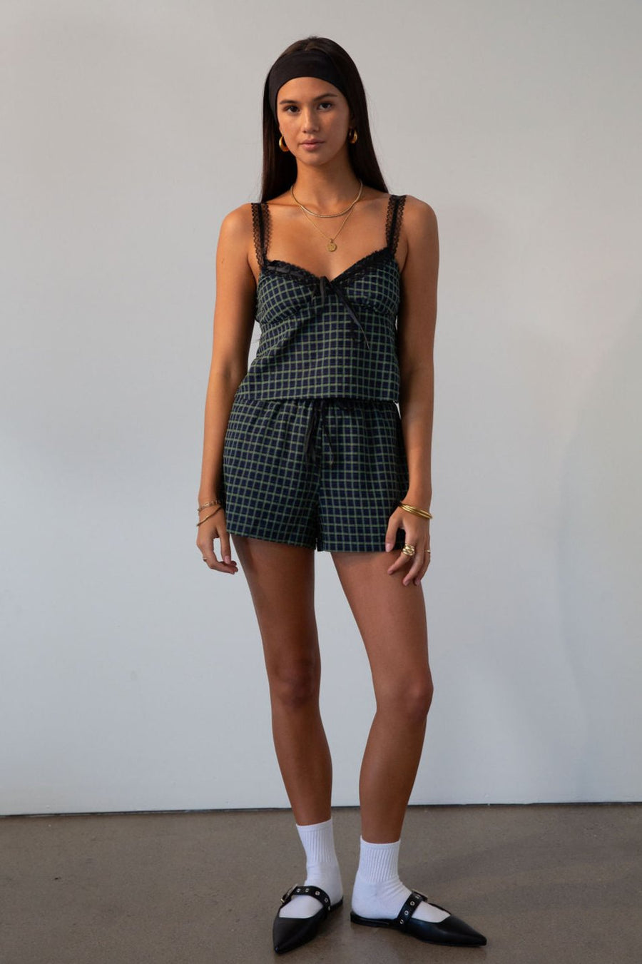 green Checkered woven cropped tank. Lace trim. Adjustable straps. Front tie. Elastic back. Partially lined. fall outfit