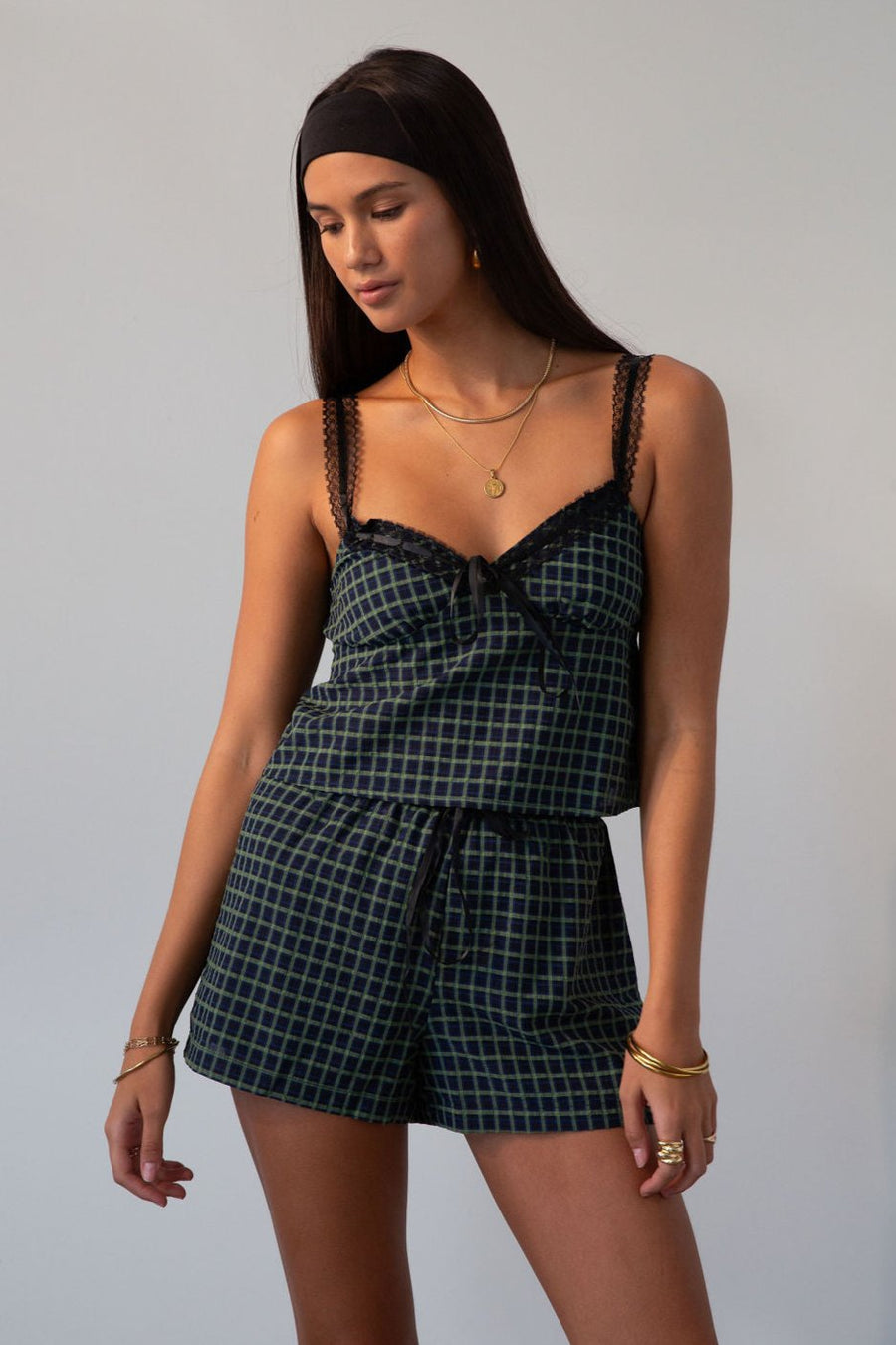 green Checkered woven shorts. Lace trim. Elastic waistband. Tie waist. Back pockets. Fully lined. fall outfit