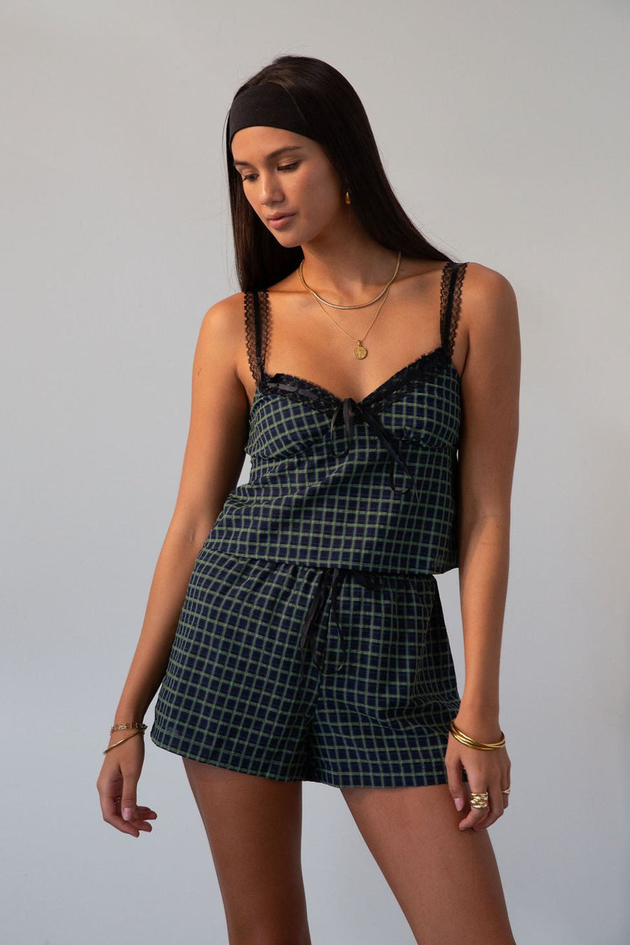 green Checkered woven cropped tank. Lace trim. Adjustable straps. Front tie. Elastic back. Partially lined. fall outfit