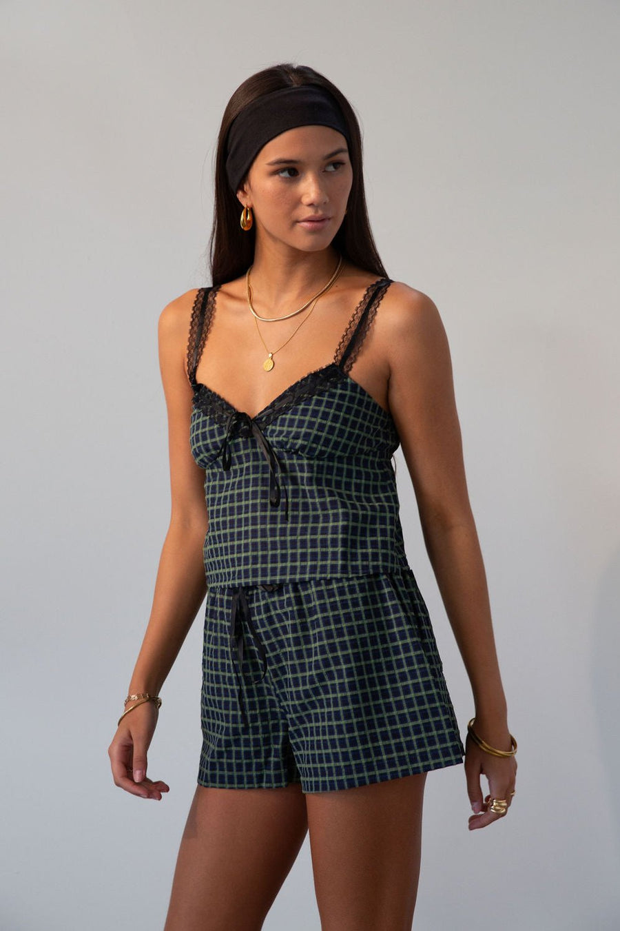 green Checkered woven cropped tank. Lace trim. Adjustable straps. Front tie. Elastic back. Partially lined. fall outfit