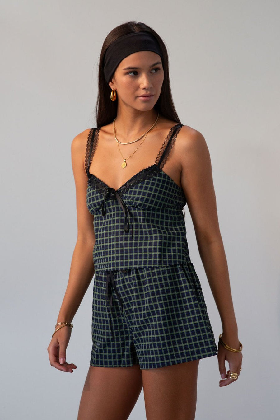 green Checkered woven shorts. Lace trim. Elastic waistband. Tie waist. Back pockets. Fully lined. fall outfit