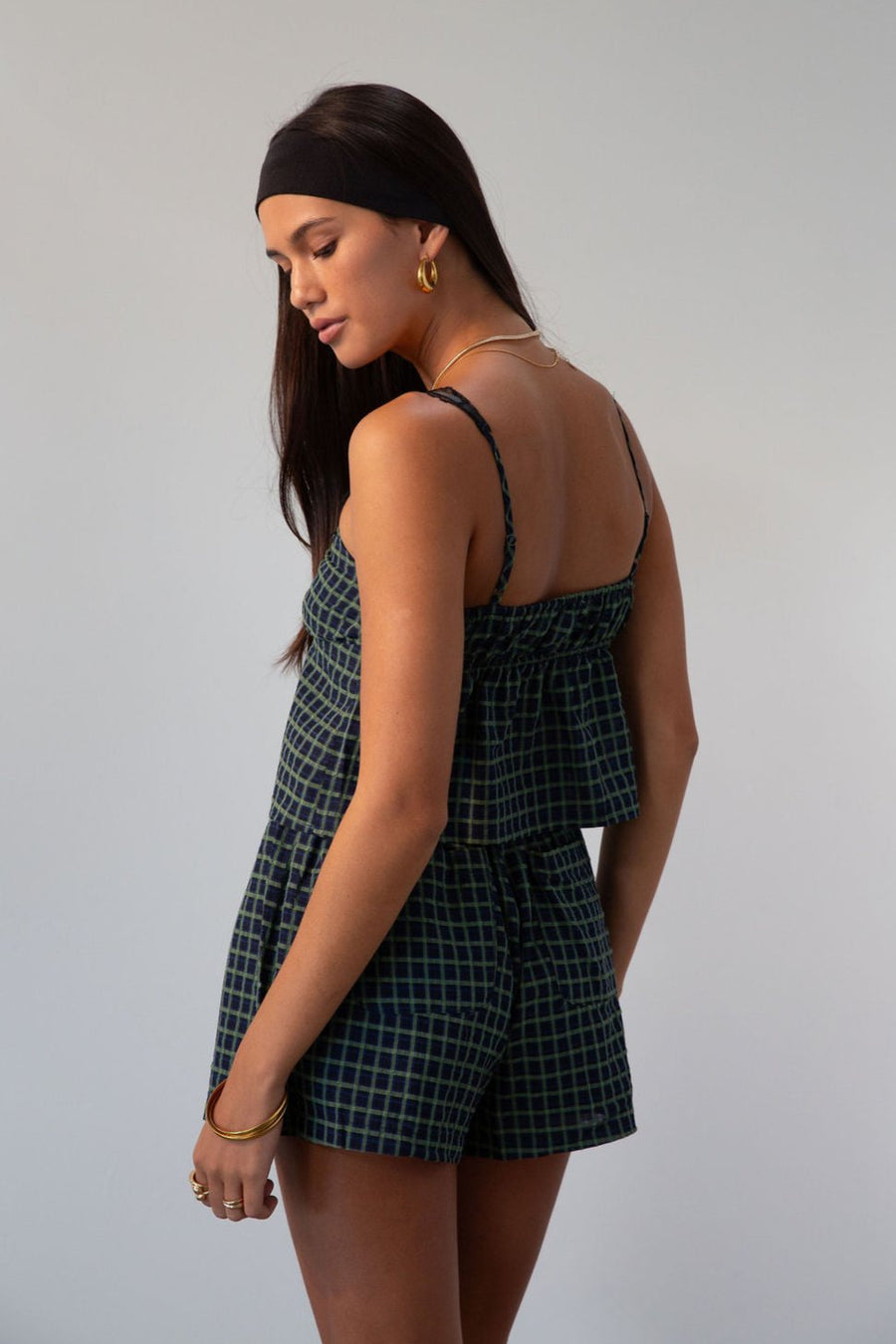 green Checkered woven cropped tank. Lace trim. Adjustable straps. Front tie. Elastic back. Partially lined. fall outfit
