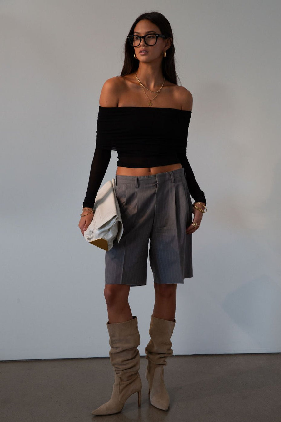 Knit top. Folded off the shoulder neckline. Long sleeves. Unlined/sheer. black off the shoulder long sleeve. fall outfit