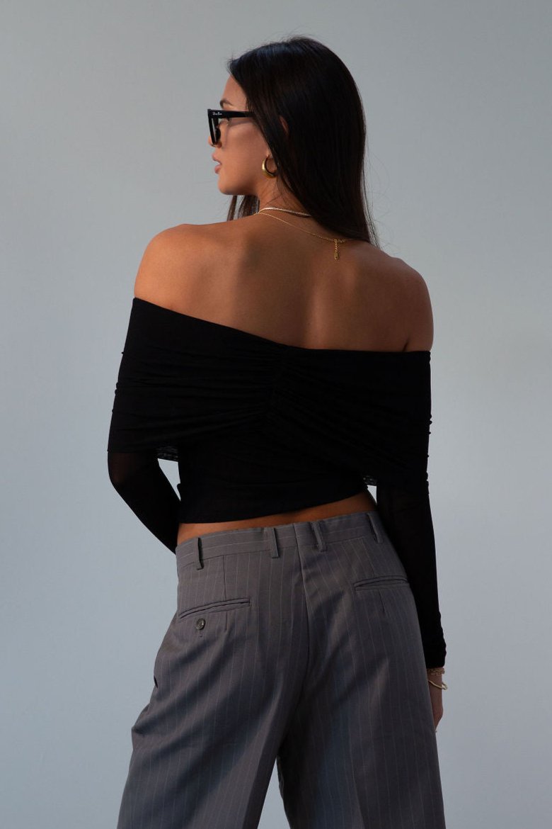 Knit top. Folded off the shoulder neckline. Long sleeves. Unlined/sheer. black off the shoulder long sleeve. fall outfit