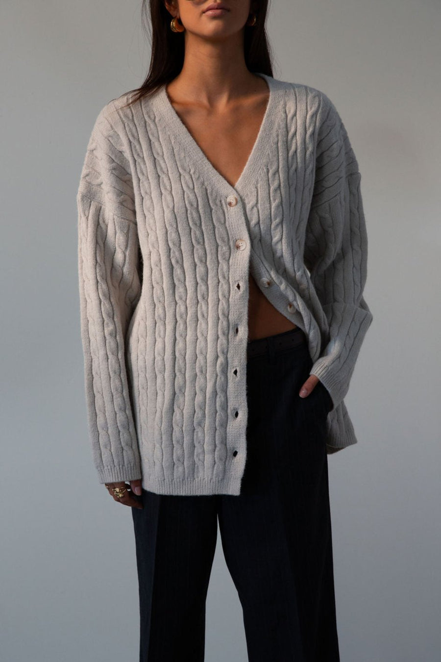 Fuzzy cable knit cardigan. Long sleeves. Front button down closures. Unlined. grey cardigan. grey sweater. fall outfit