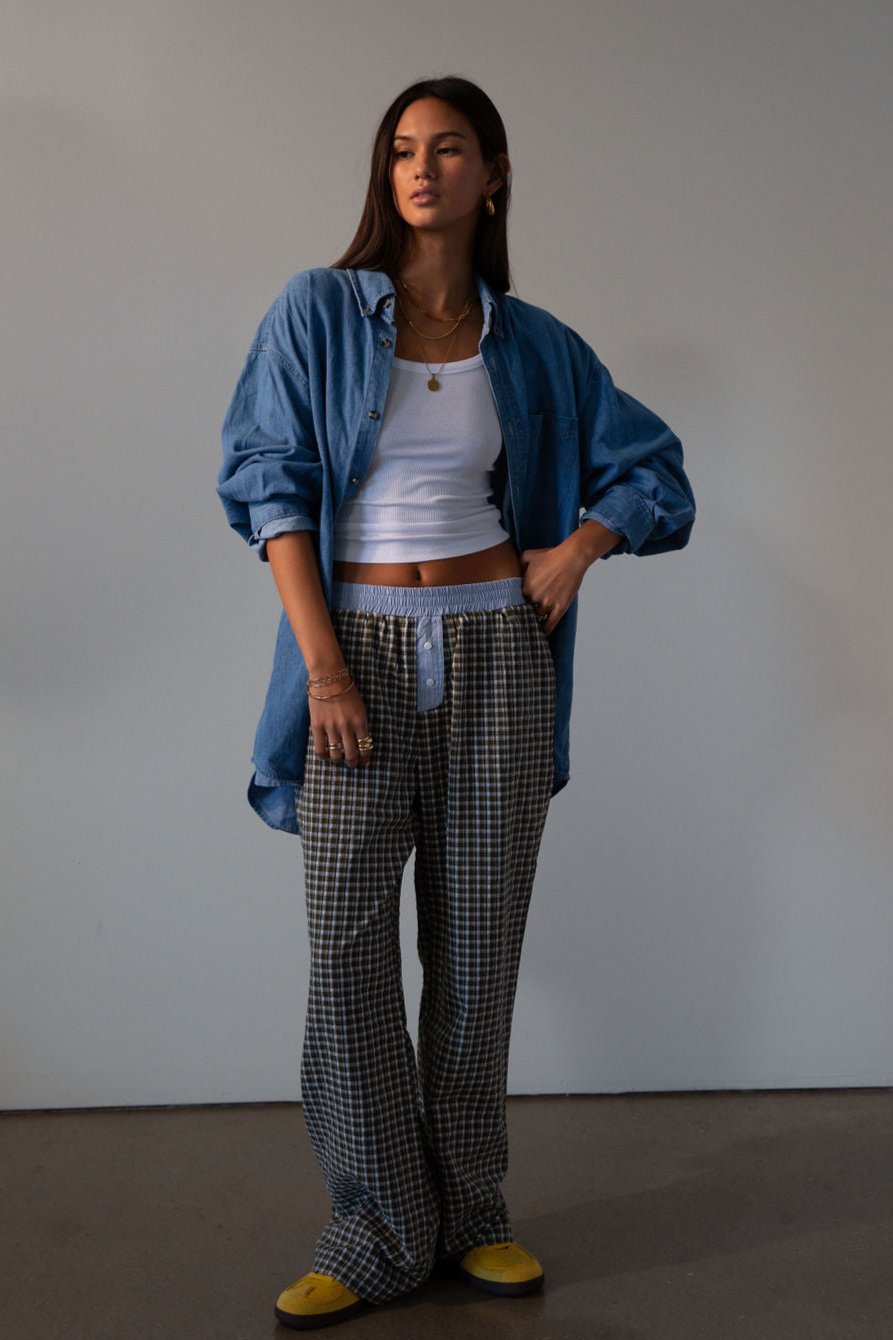Plaid woven pants. Elastic waistband. Faux button fly. Side pockets. Fully lined. lounge pants. boxer pants
