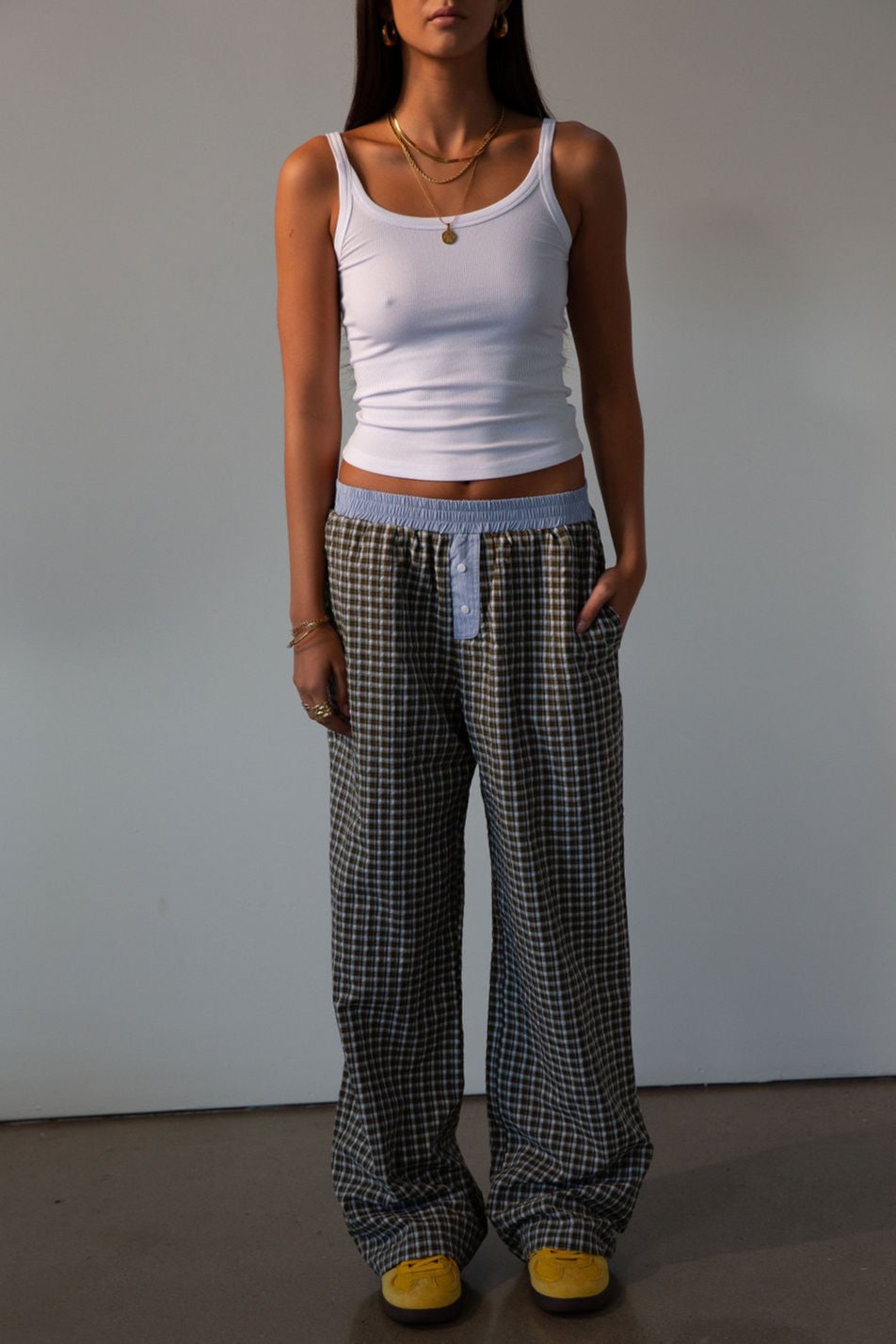 Plaid woven pants. Elastic waistband. Faux button fly. Side pockets. Fully lined. lounge pants. boxer pants