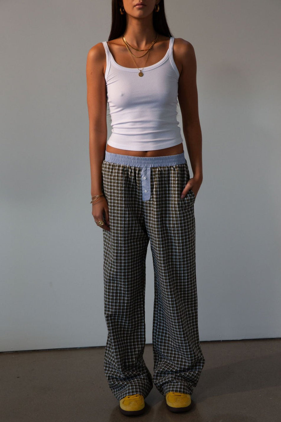 Plaid woven pants. Elastic waistband. Faux button fly. Side pockets. Fully lined. lounge pants. boxer pants