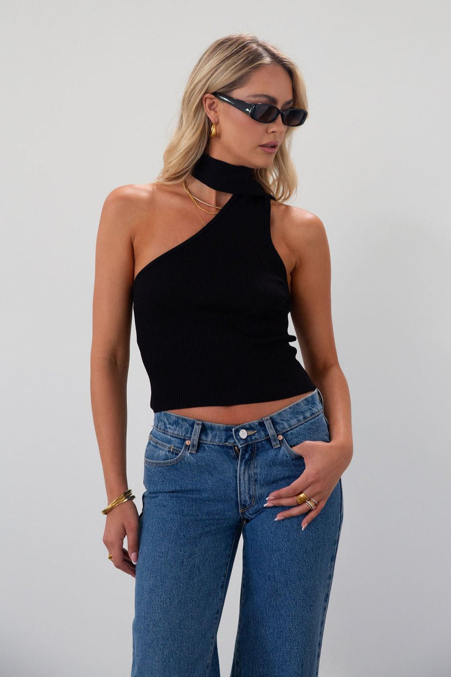 Ribbed knit cropped tank. Asymmetric neckline with adjustable halter tie. Unlined. black tank. fall outfit. fall top. going out top