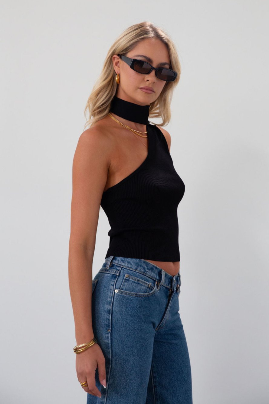 Ribbed knit cropped tank. Asymmetric neckline with adjustable halter tie. Unlined. black tank. fall outfit. fall top. going out top