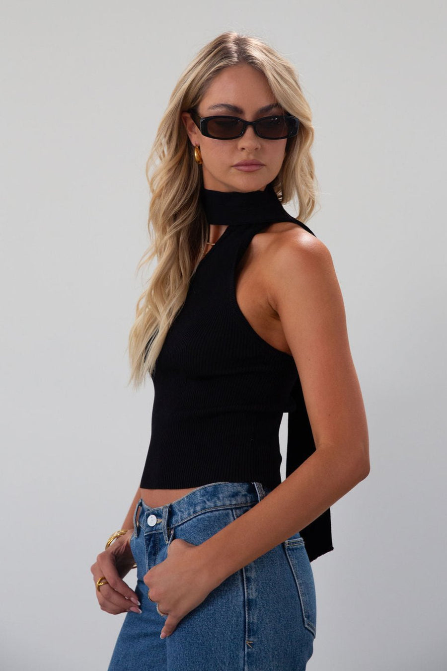 Ribbed knit cropped tank. Asymmetric neckline with adjustable halter tie. Unlined. black tank. fall outfit. fall top. going out top