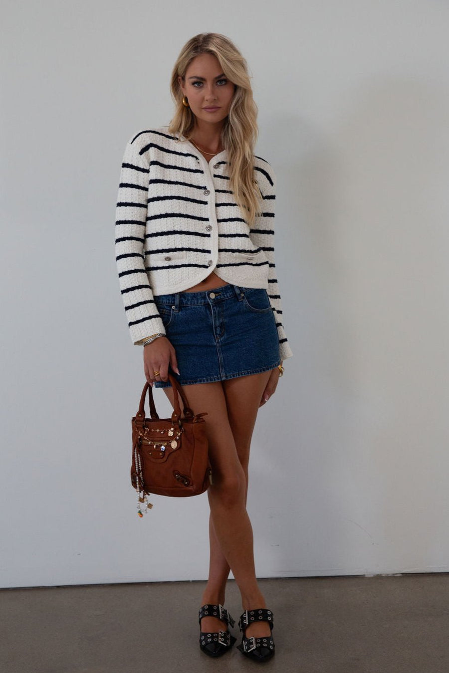 Striped crochet knit cropped cardigan. Front button down closure. Faux front pockets. Unlined. fall outfit. fall top. striped cardigan